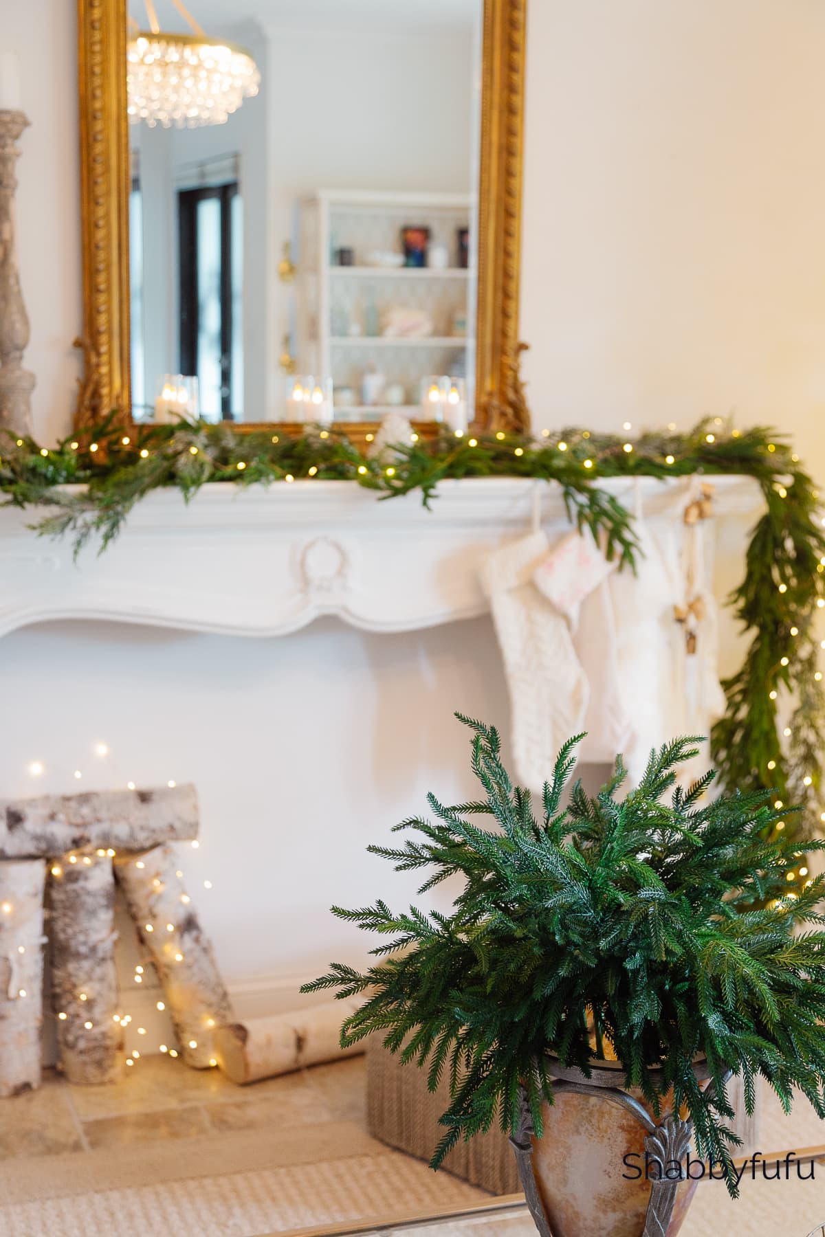 faux fireplace at Christmas with twinkle lights