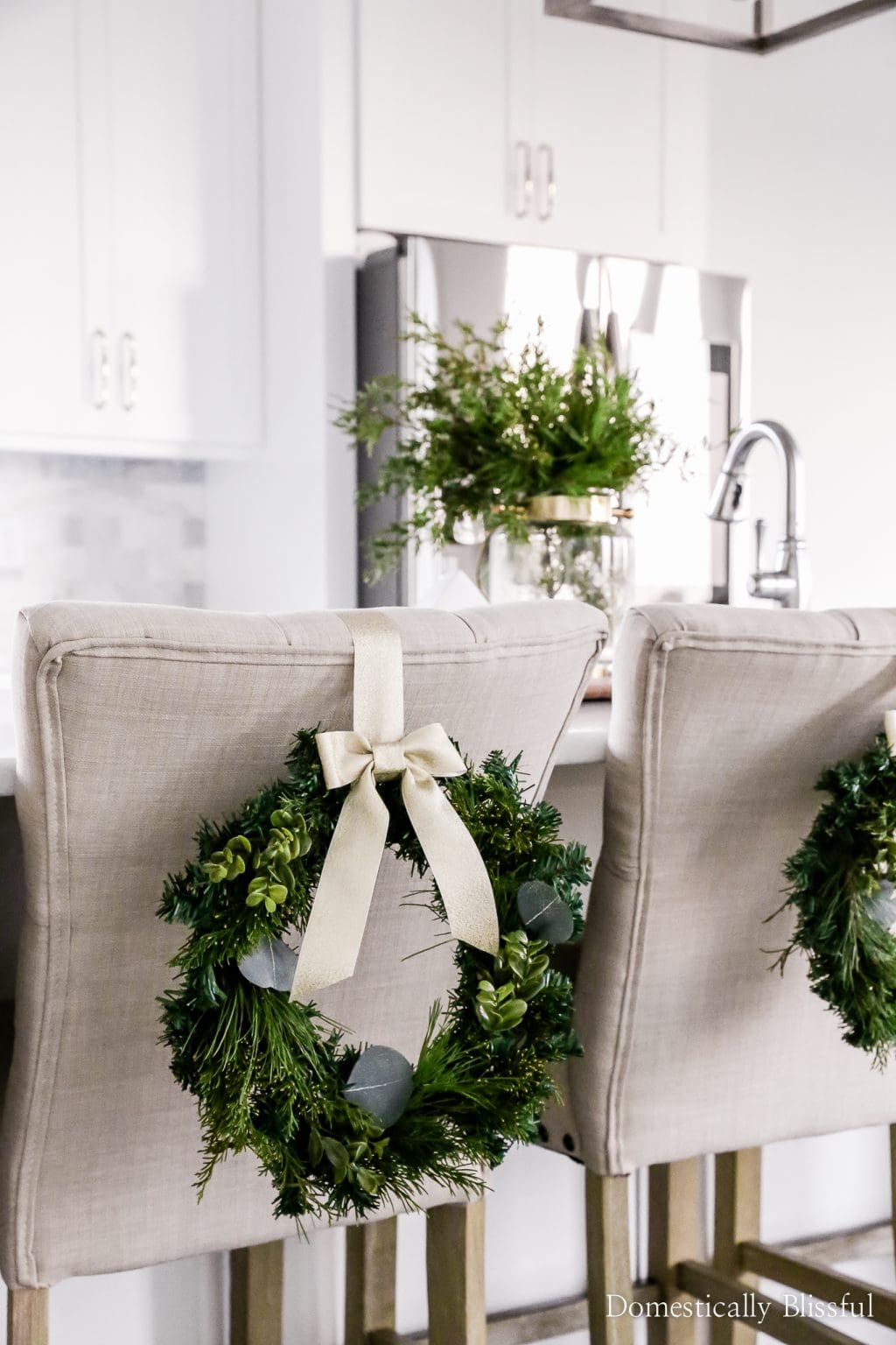wreath idea with bow against the back of a chair