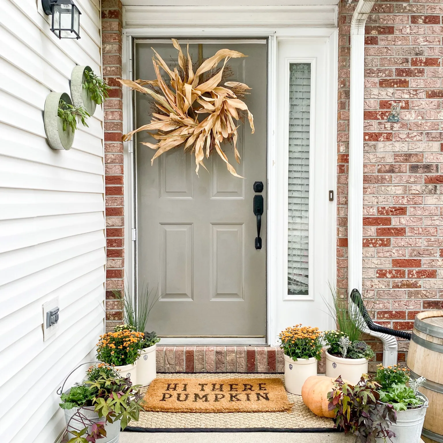 Porch featuring front door with wreath idea