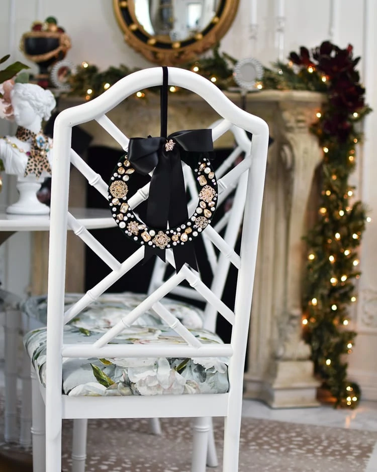 wreath idea with sparkle details and bow against the back of a chair