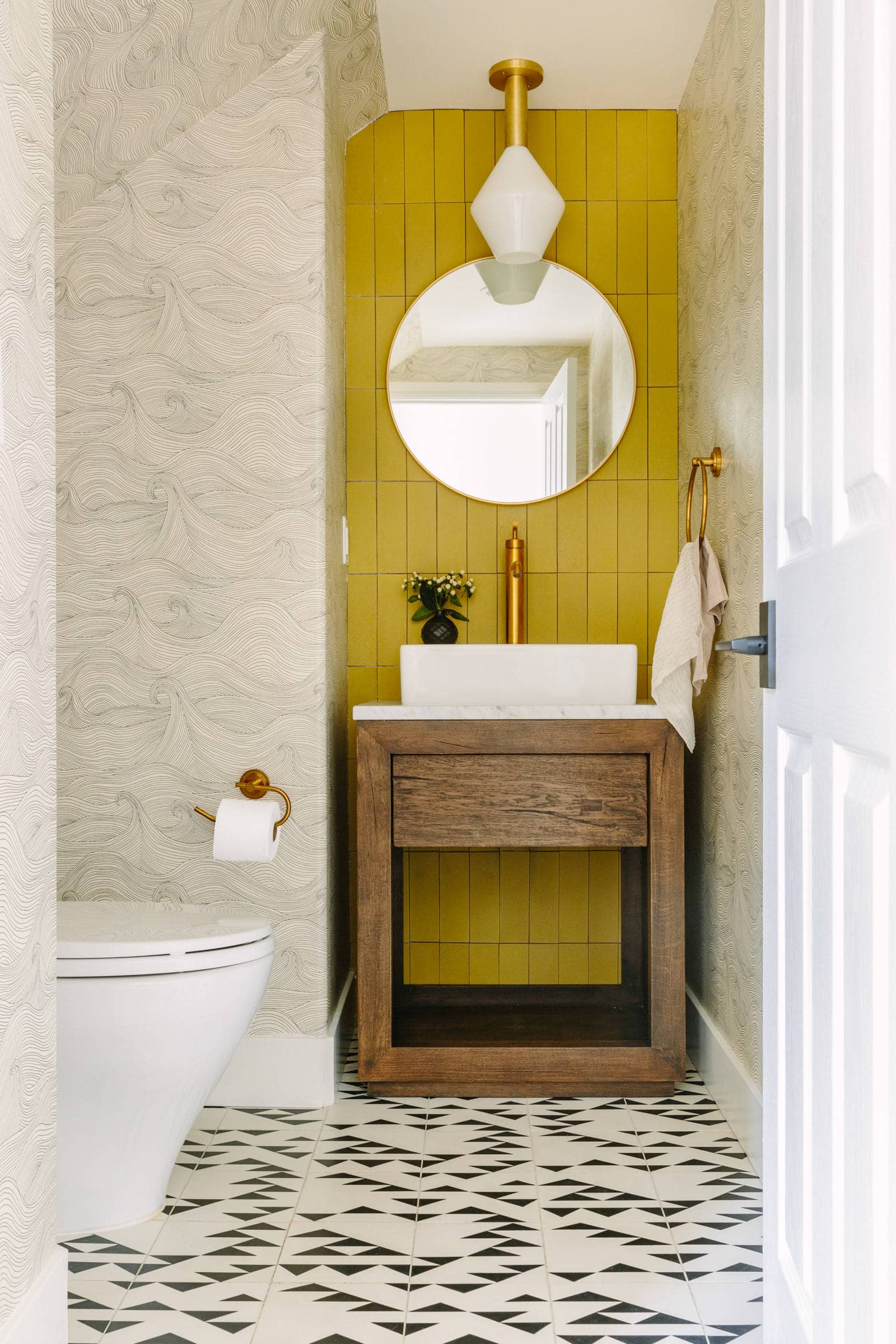 home decor design trends for 2024 featuring small bathroom with electric green yellow tiles accent walls