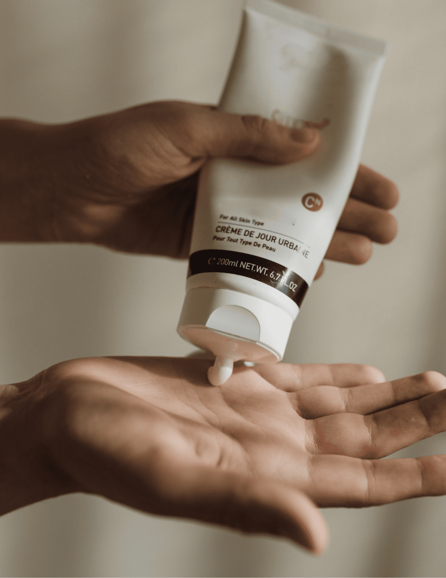 Hand applying hand cream for a Winter self-care routines and practices blog post