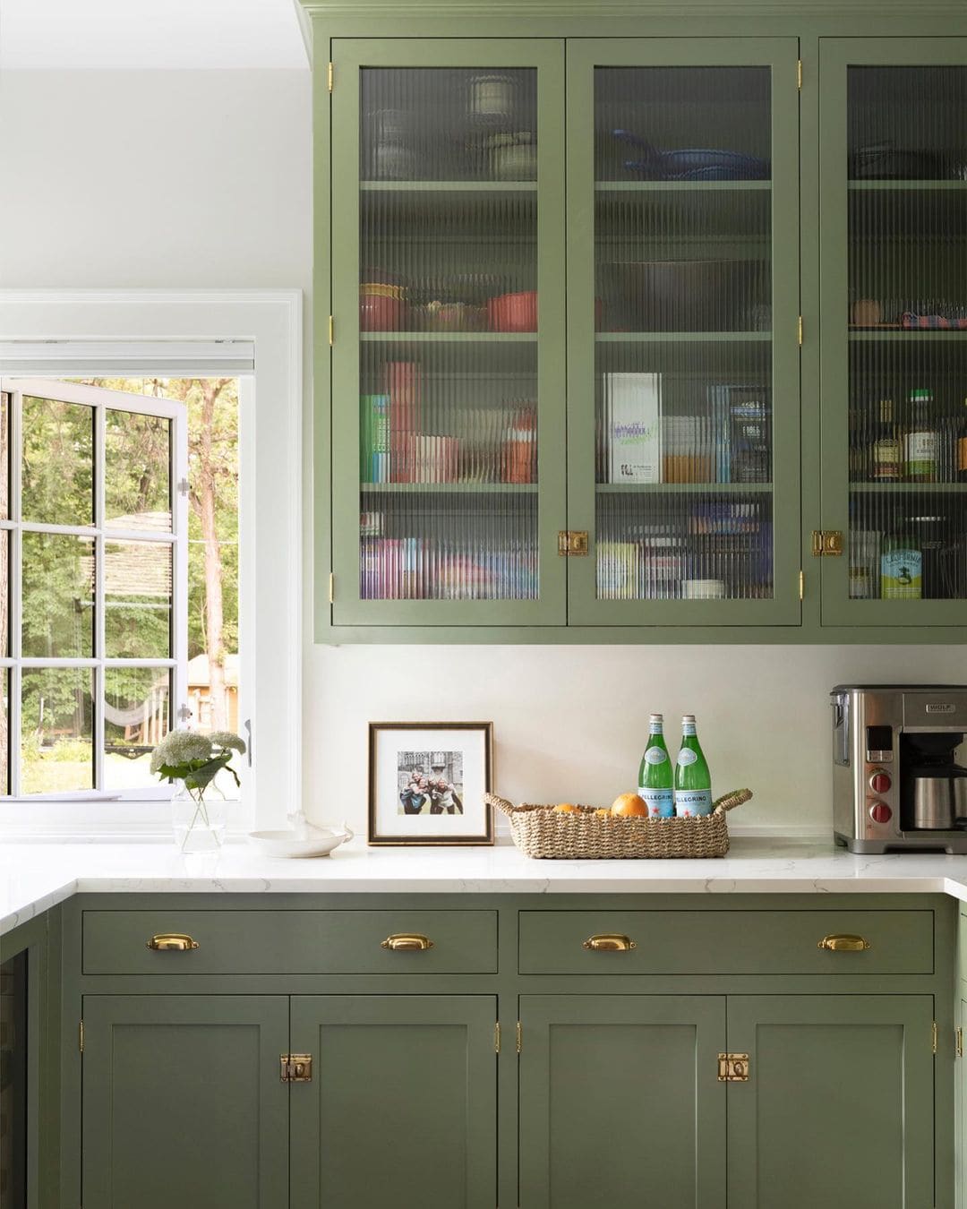 Kitchen featuring green cabinets in trendy decor style featured in "Timeless vs. Trendy Decor" 