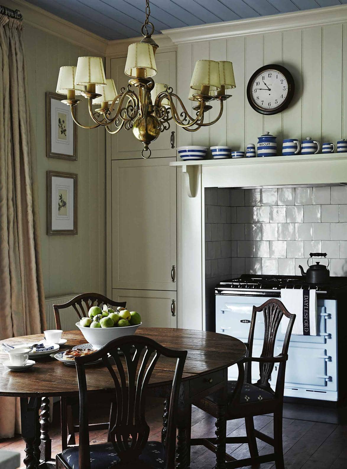 Timeless allure of old homes example showcasing a traditional kitchen with an alcove stove and antique tiles