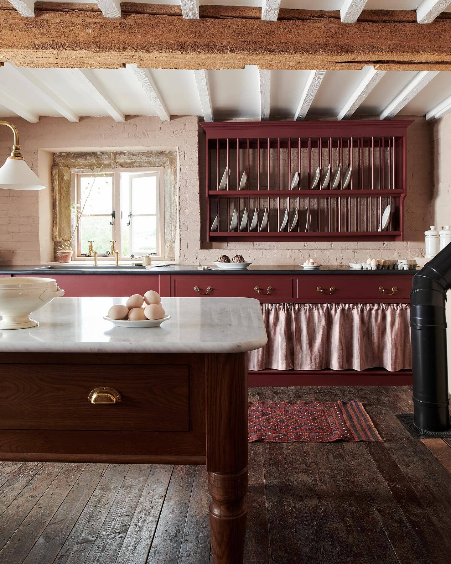 Timeless allure of old homes example showcasing a traditional kitchen in red tones