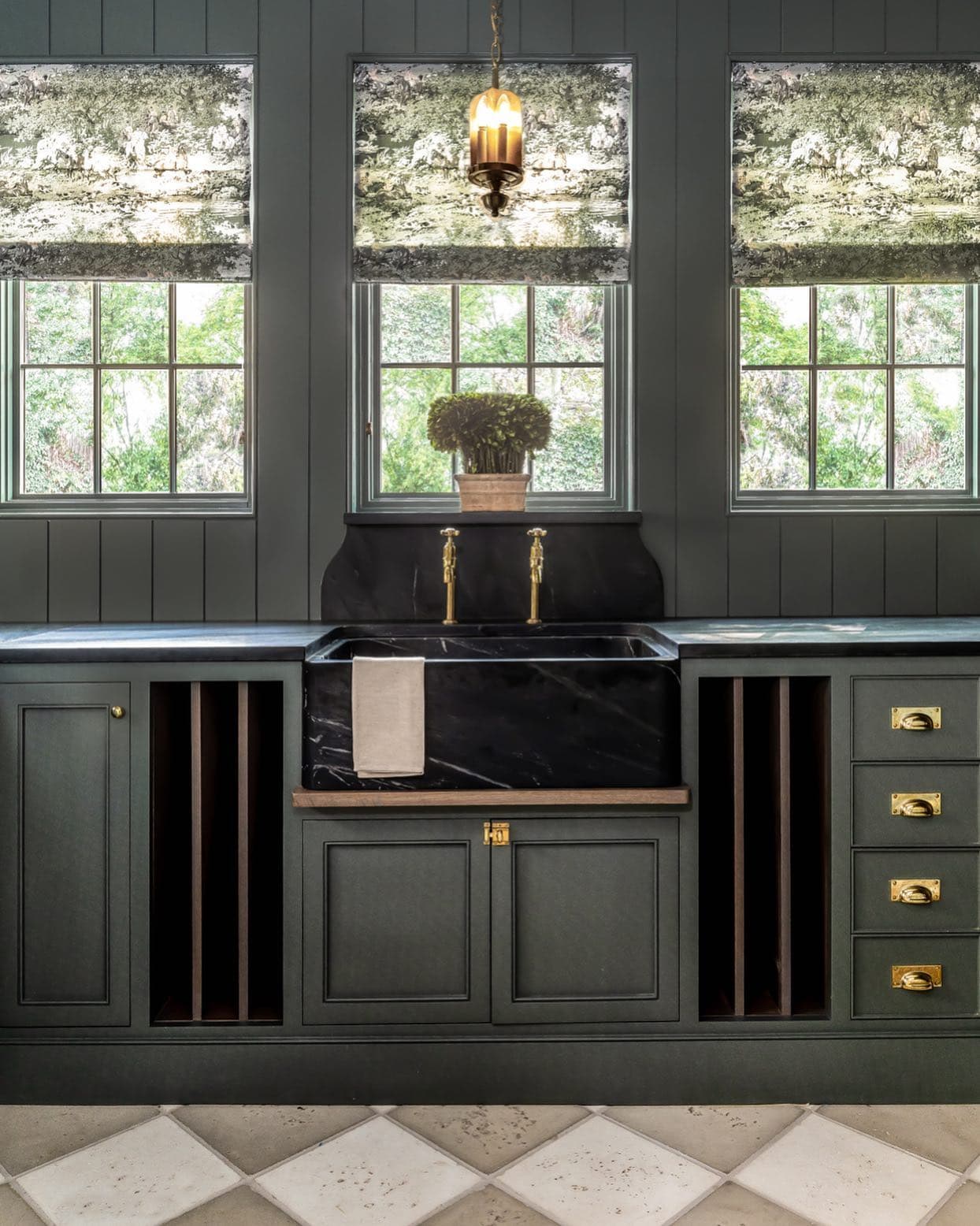Traditional kitchen in dark green as example of green home decor