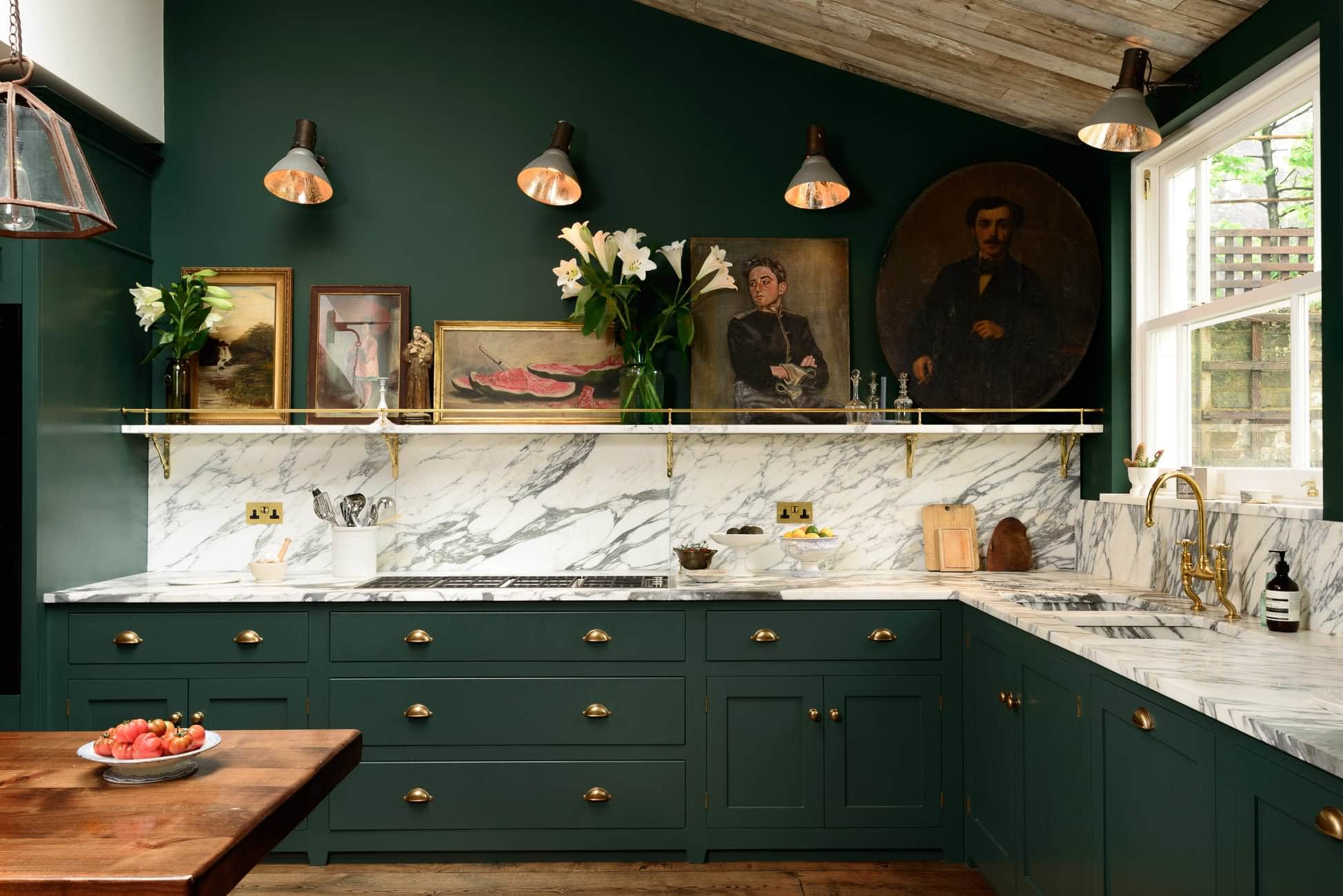 Dark green kitchen featuring green counters and marble backsplash, home decor ideas
