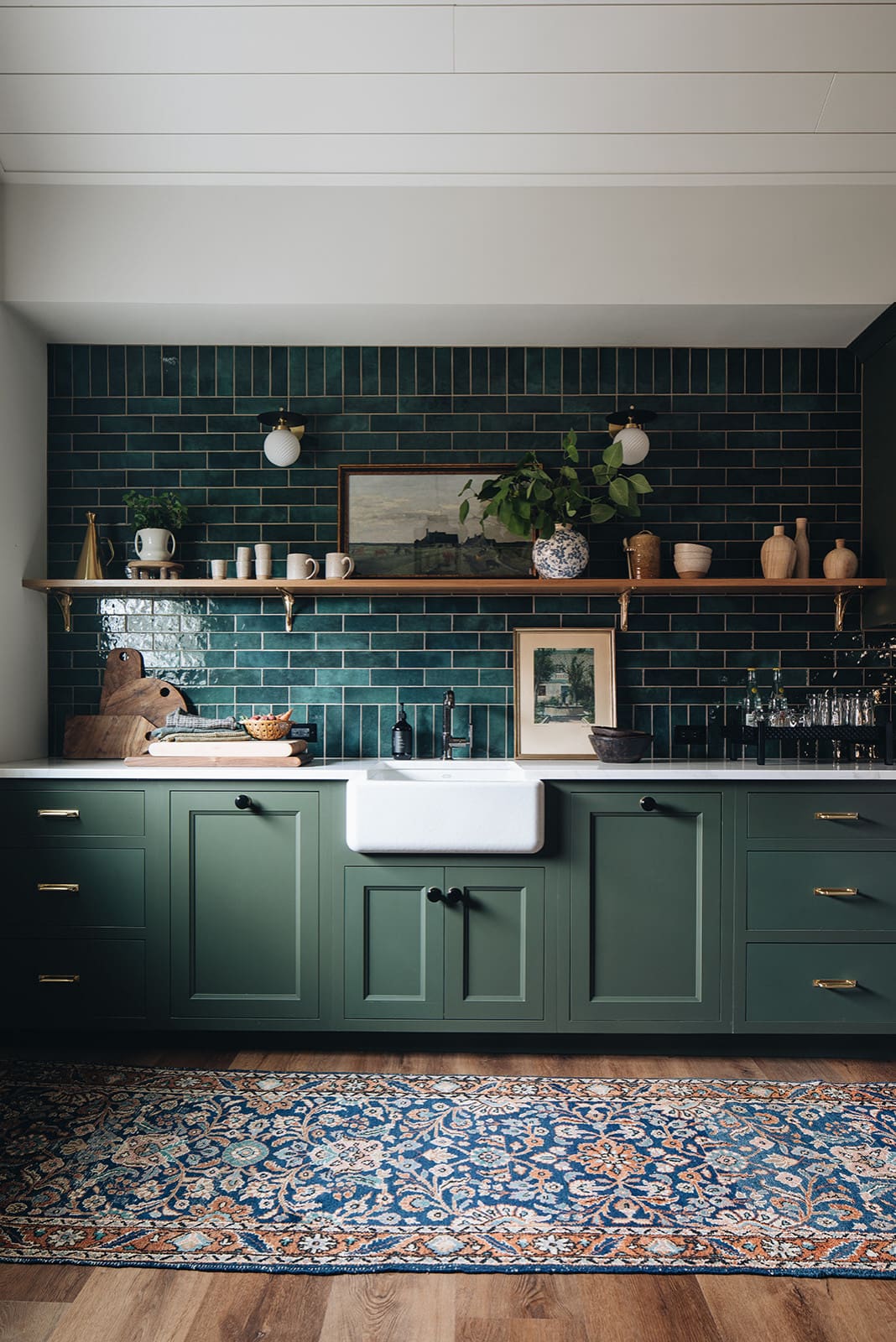 Dark and lush green kitchen featuring green counters and backsplash, green home decor ideas