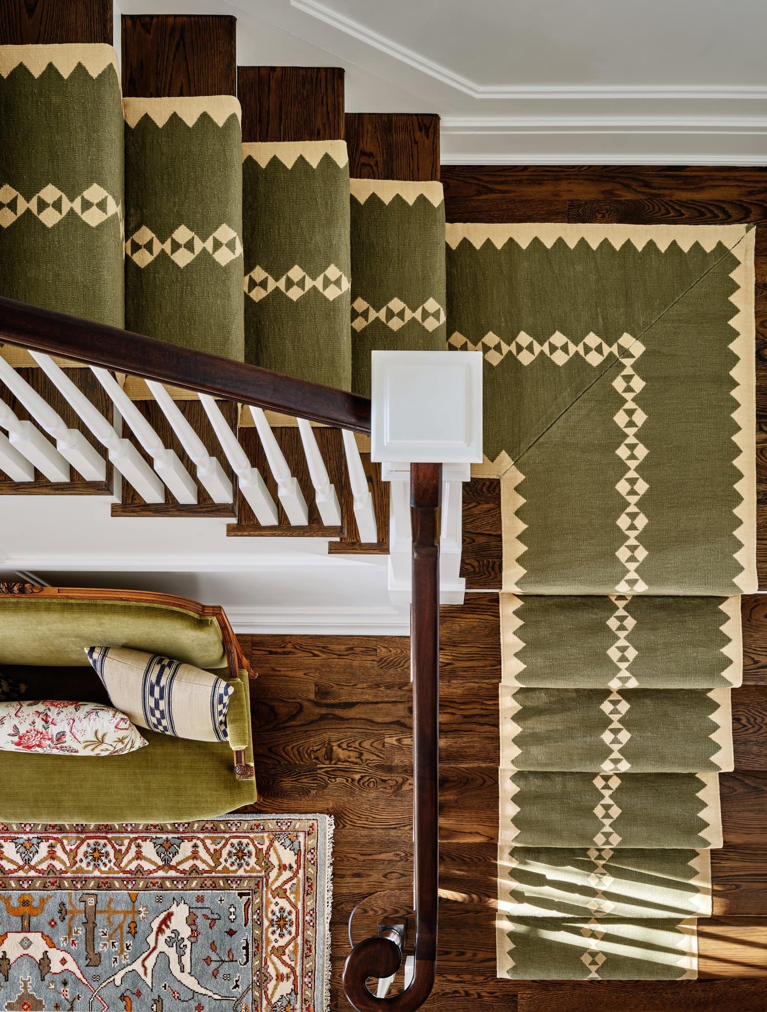 Ariel Okin interior design project New Canaan featuring staircase with green carpet