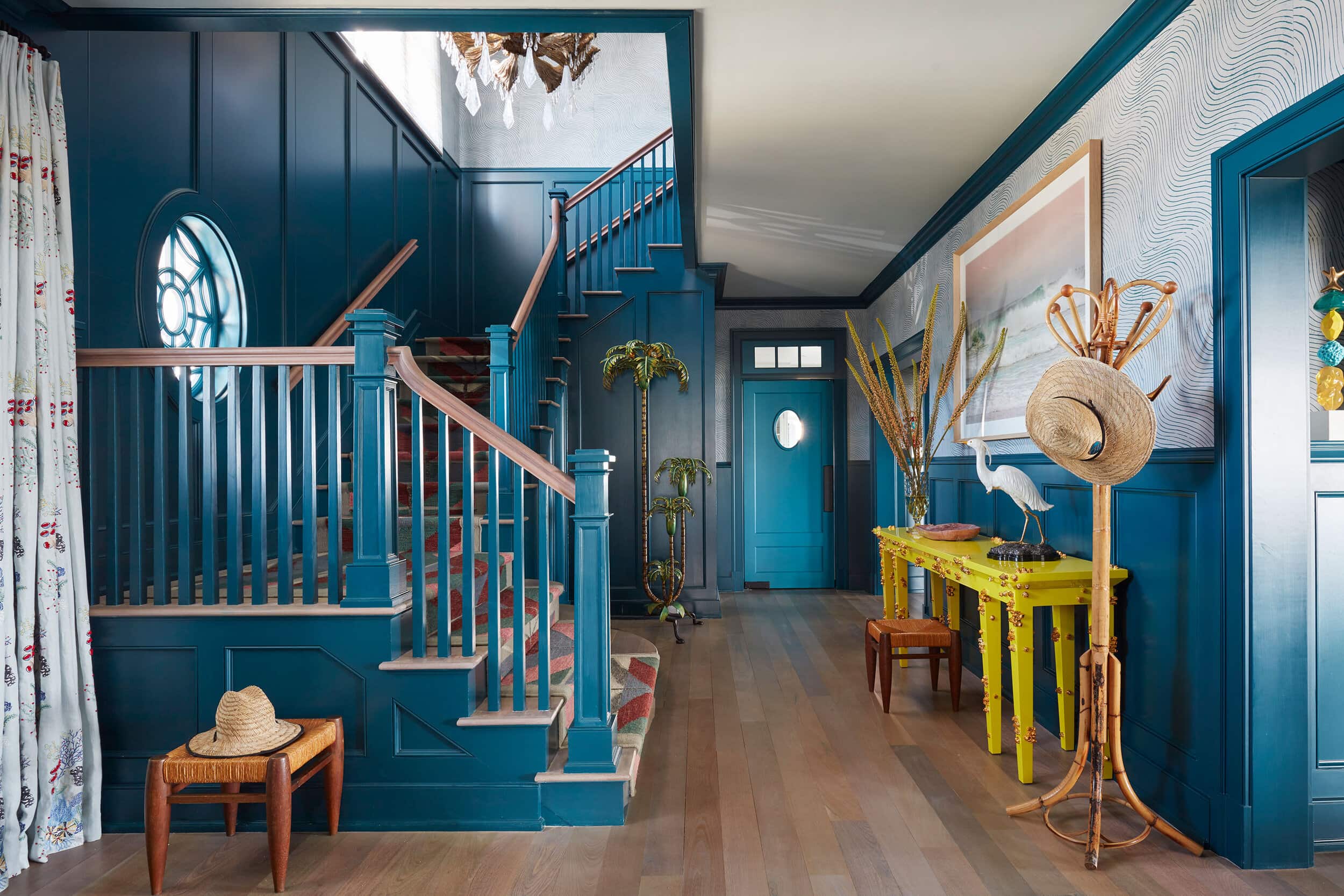 Wesley Moon interior design featuring coastal entrwyway with deep blue walls.