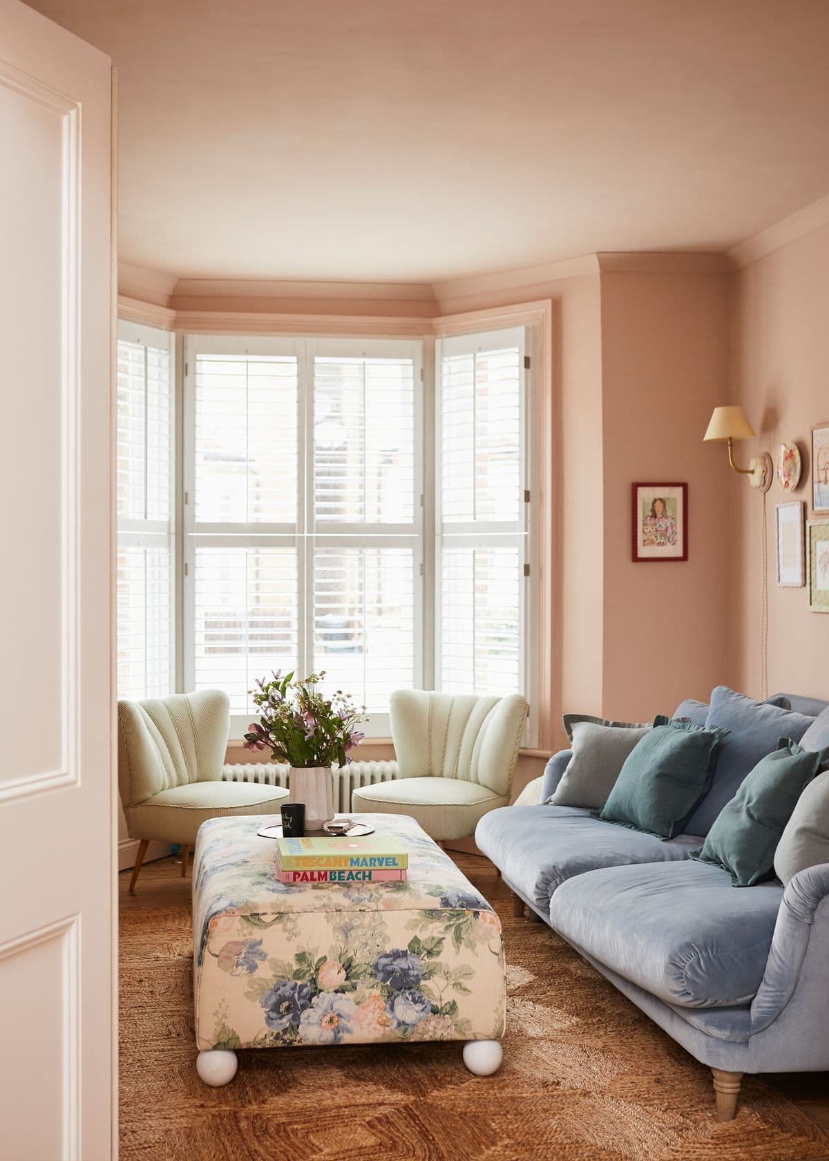 Spring color palette ideas featuring vintage pastel living room with pink wall and light blue
