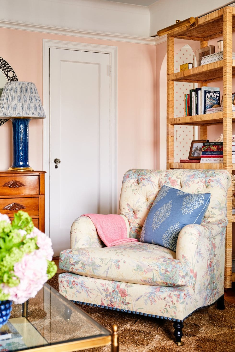Spring color palette ideas featuring vintage pastel living room with pink wall and florals