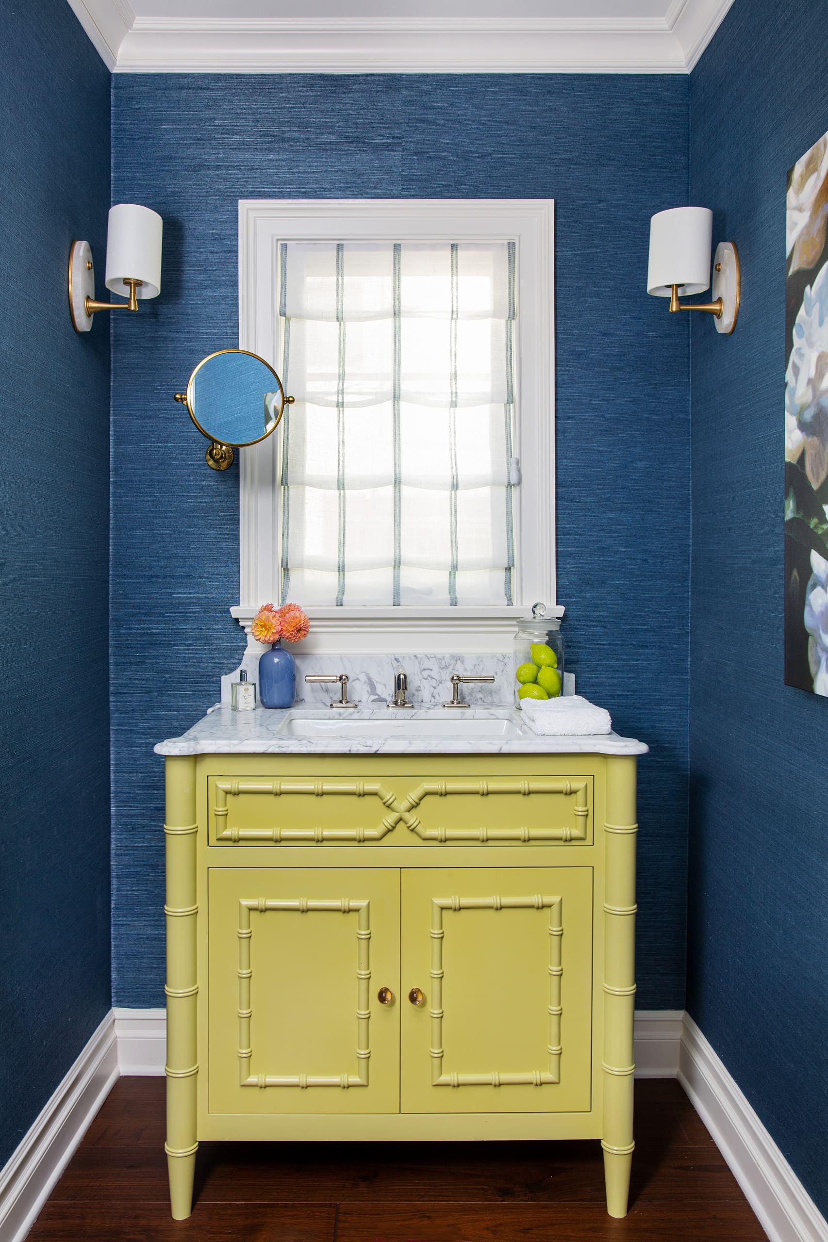Cheery beach style retreat powder room in navy blue walls a lime vanity featured in home tour