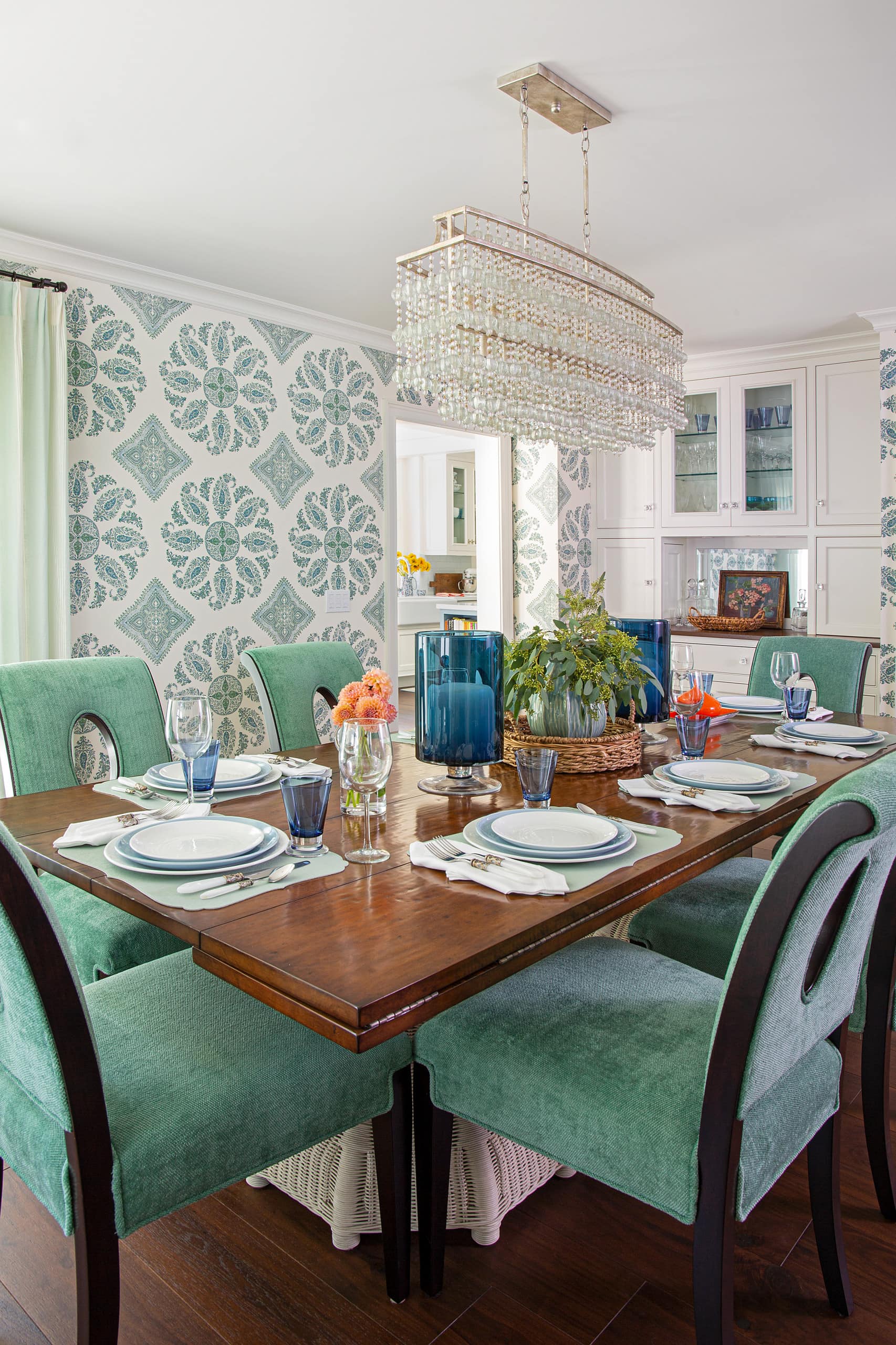 Cheery beach style retreat dining room featuring colorful dining table setting