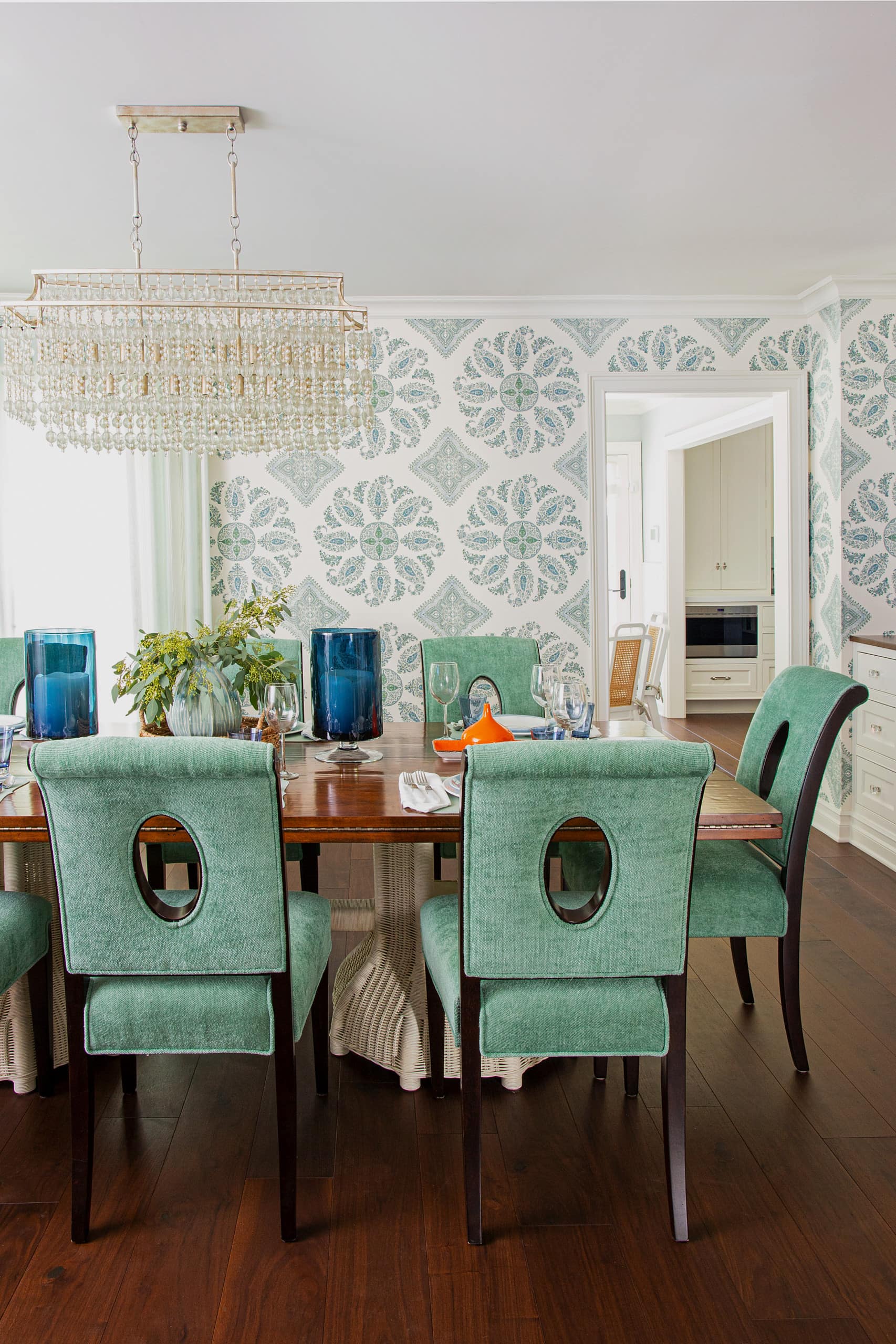 Cheery beach style retreat dining room featuring colorful dining table setting