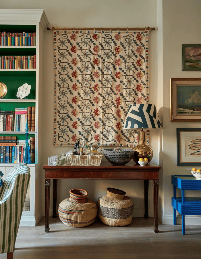Eclectic style decor idea featuring traditional living room with tapestry hanging from the wall