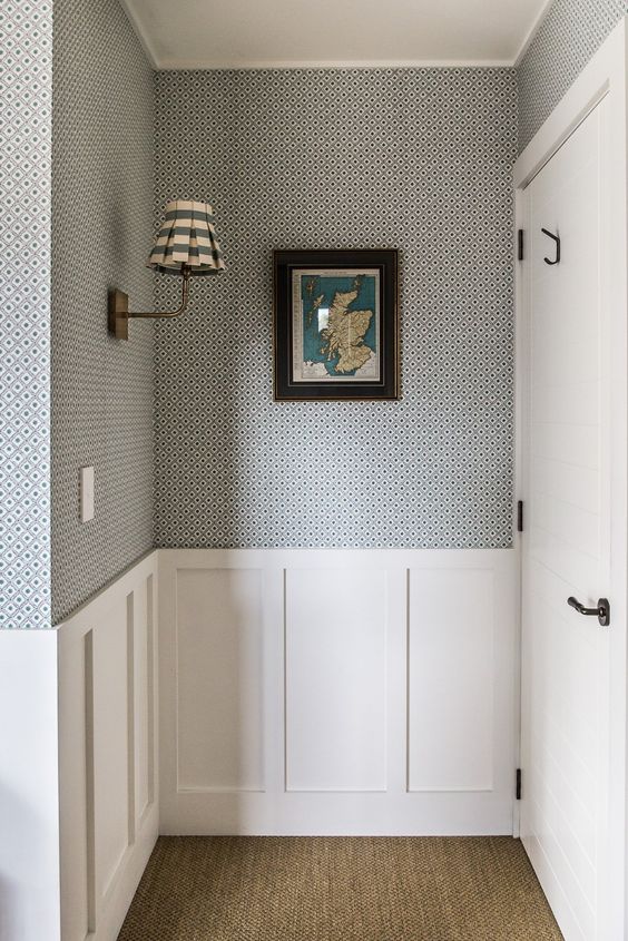 Traditional hallway featuring architectural details half wall wainscoting
