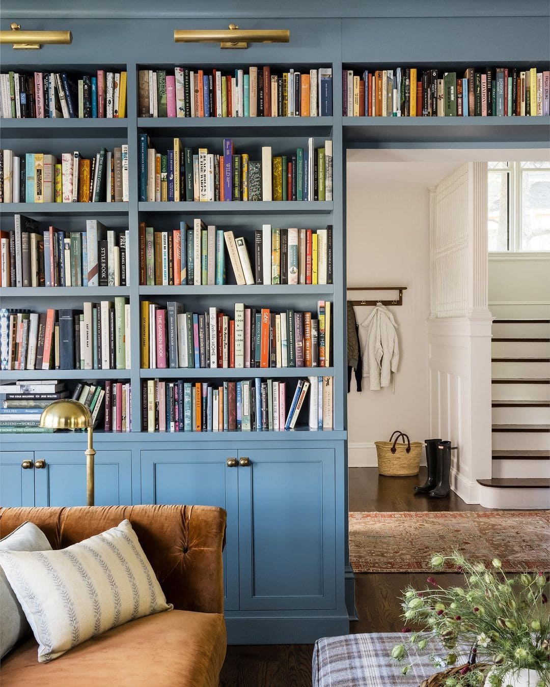 Traditional study featuring architectural details built in bookcase