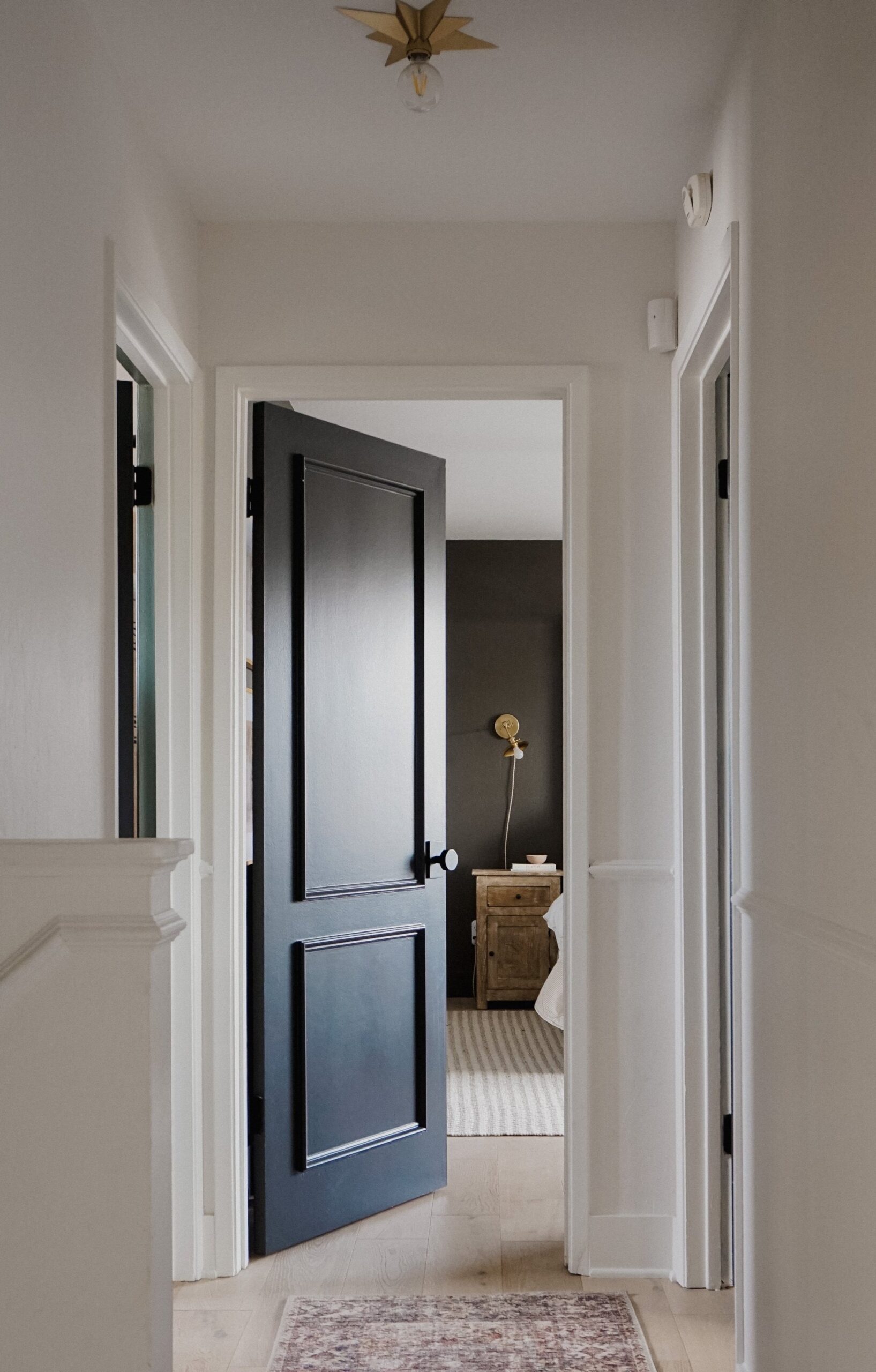 Elegant dark door featuring architectural details in trims