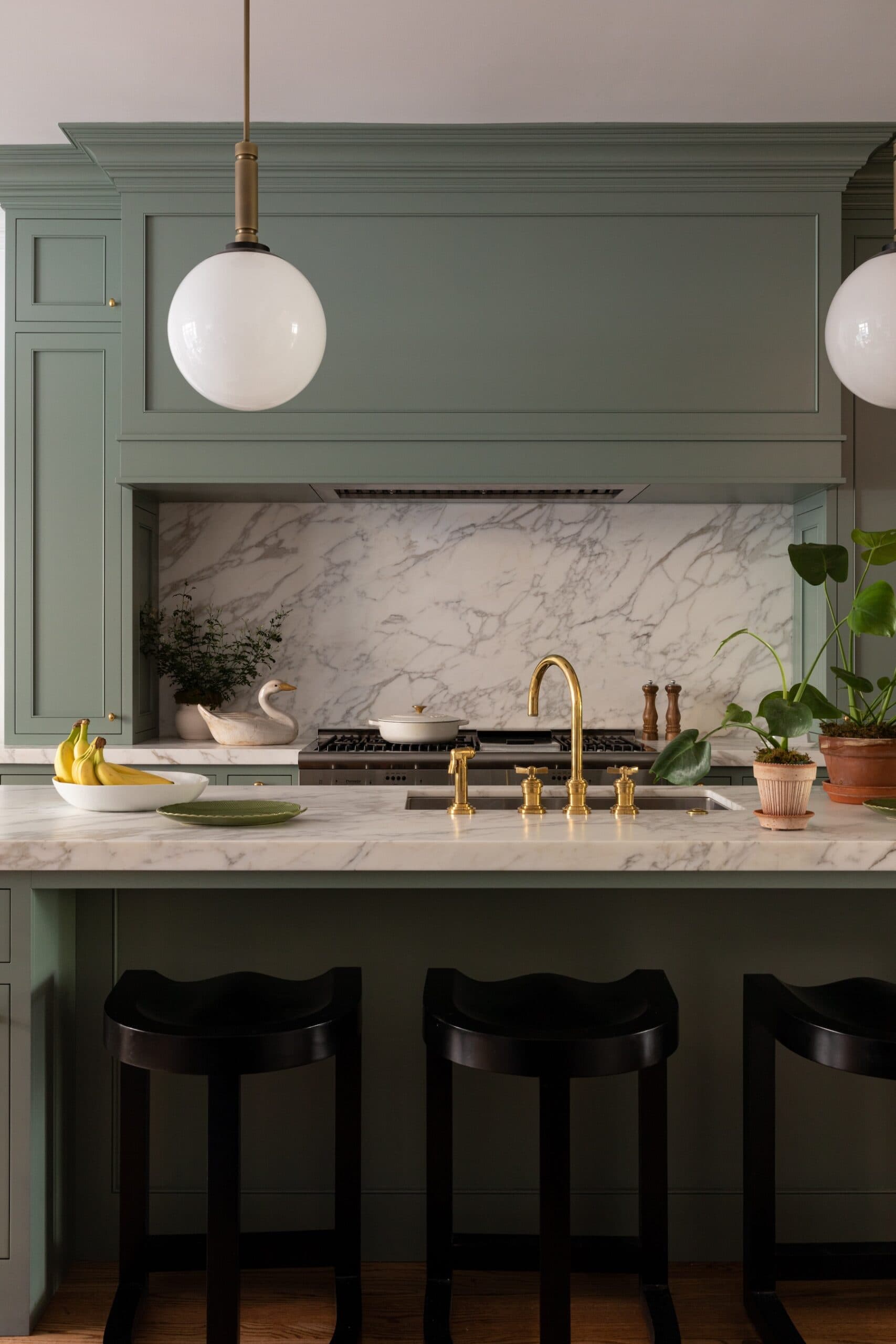 Fresh young design with mid century green style kitchen by Alexandra Kaehler.