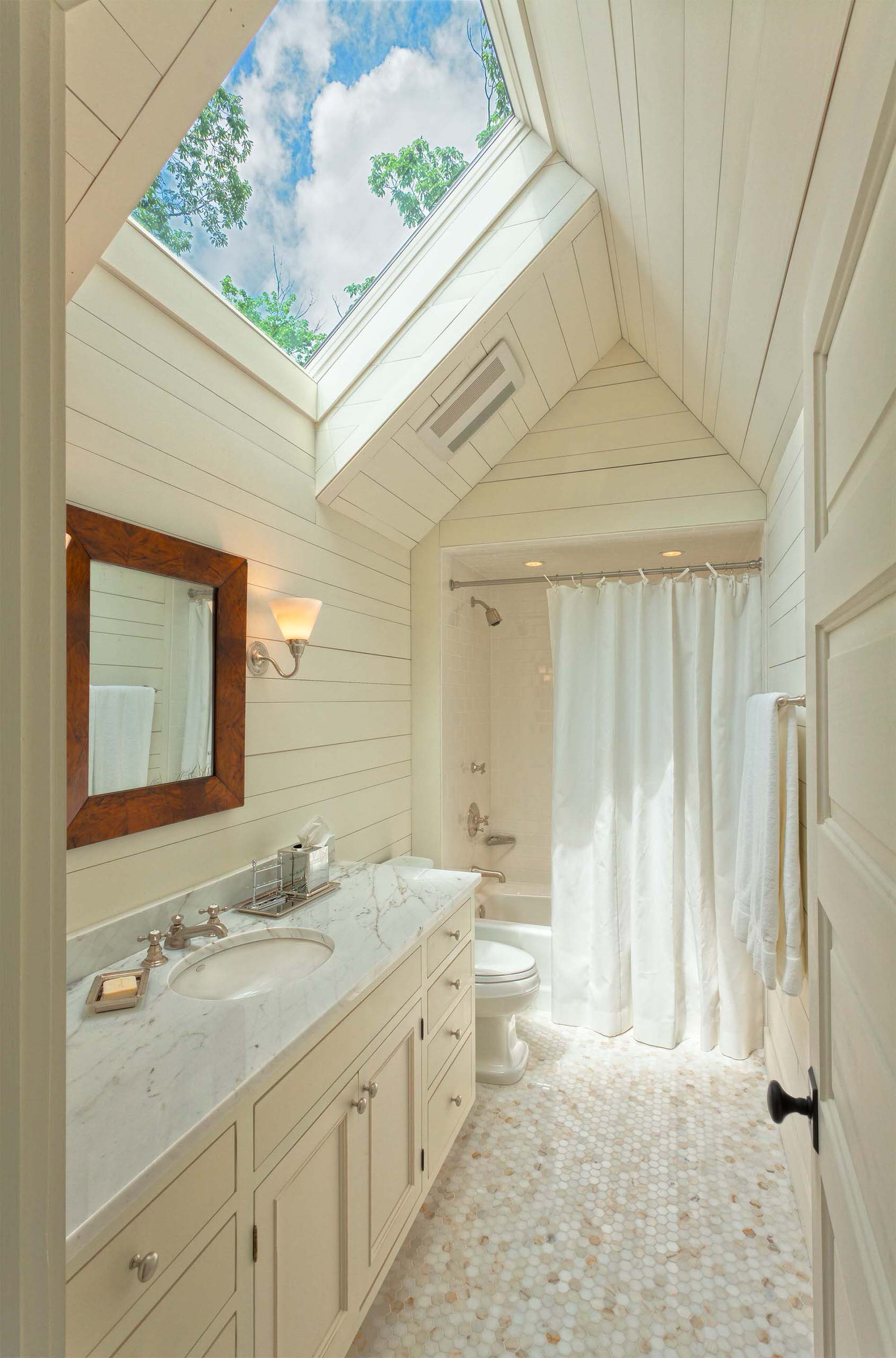 Bathroom with skylight featured as a maximize natural light idea