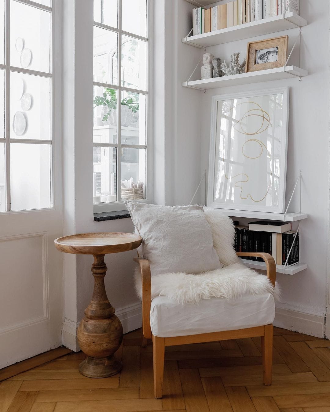 reading nook next to windows featured as a maximize natural light idea