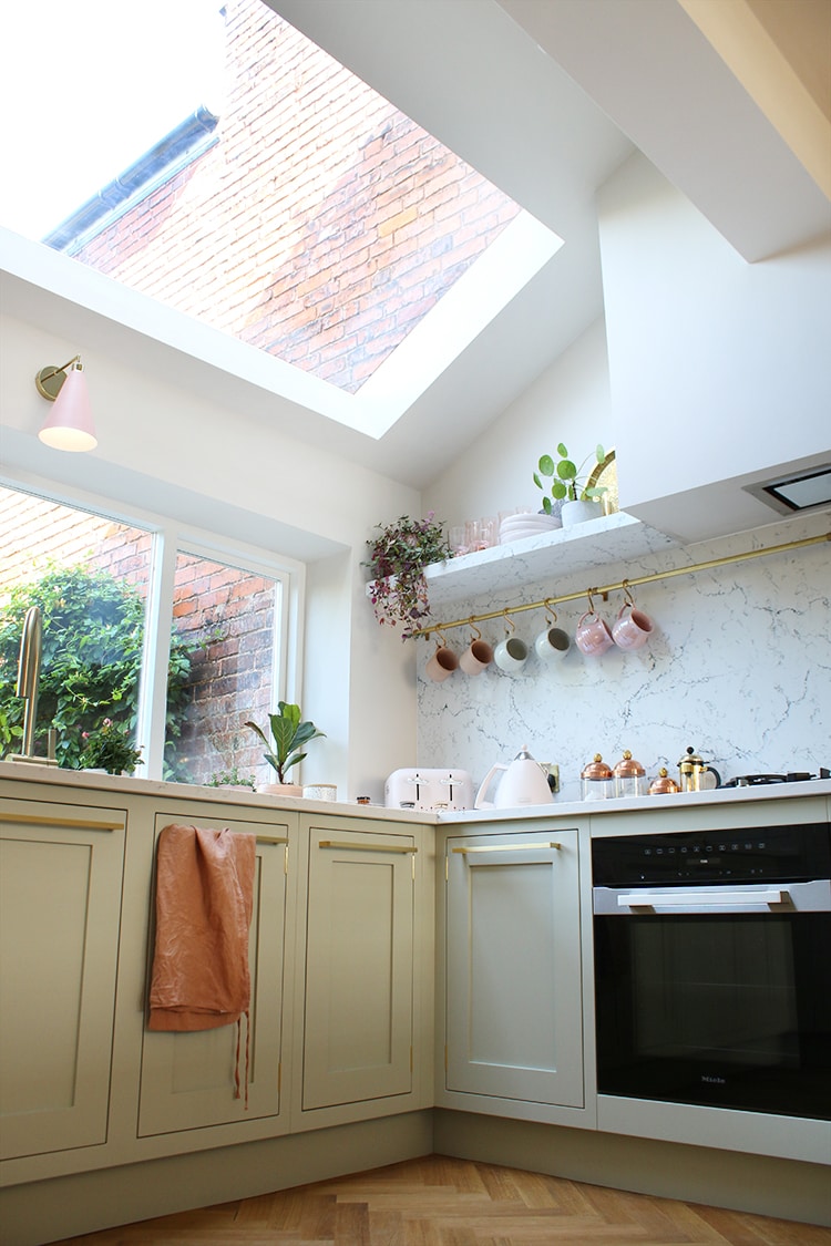 Kitchen with skylight featured as a maximize natural light idea
