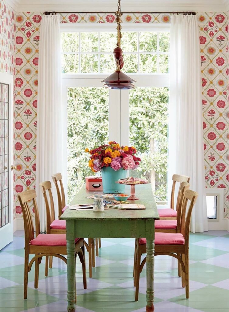 Room in beach english cottage style featuring dining room with floral wallpaper and country furniture