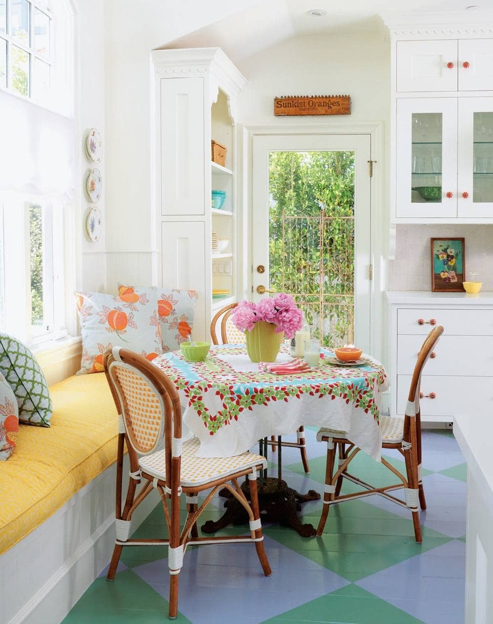Breakfast nook in beach english cottage style featuring yellow window seat