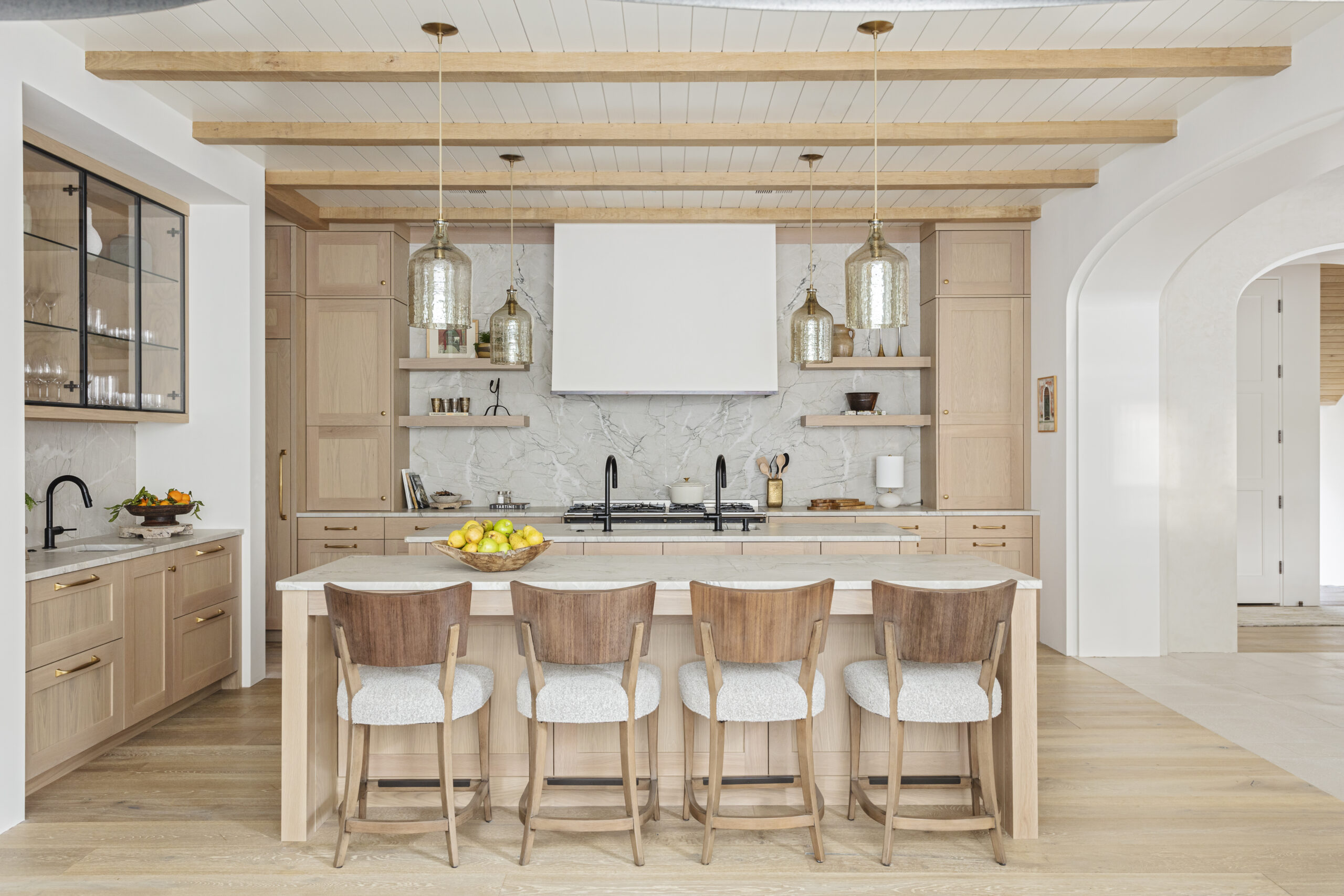 Home tour featuring kitchen with pale blonde wood designed by Margaret Donaldson