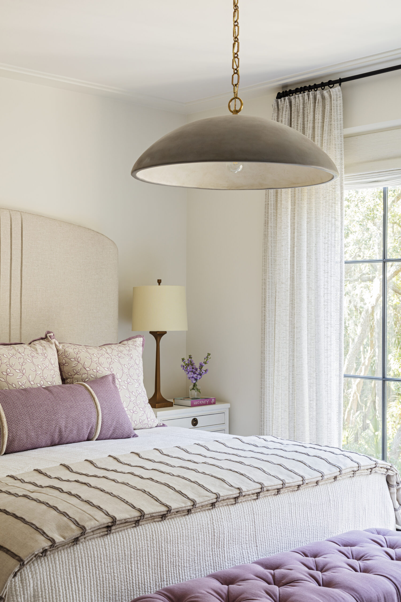 Home tour featuring bedroom with neutral color palette with lilac in transitional style designed by Margaret Donaldson