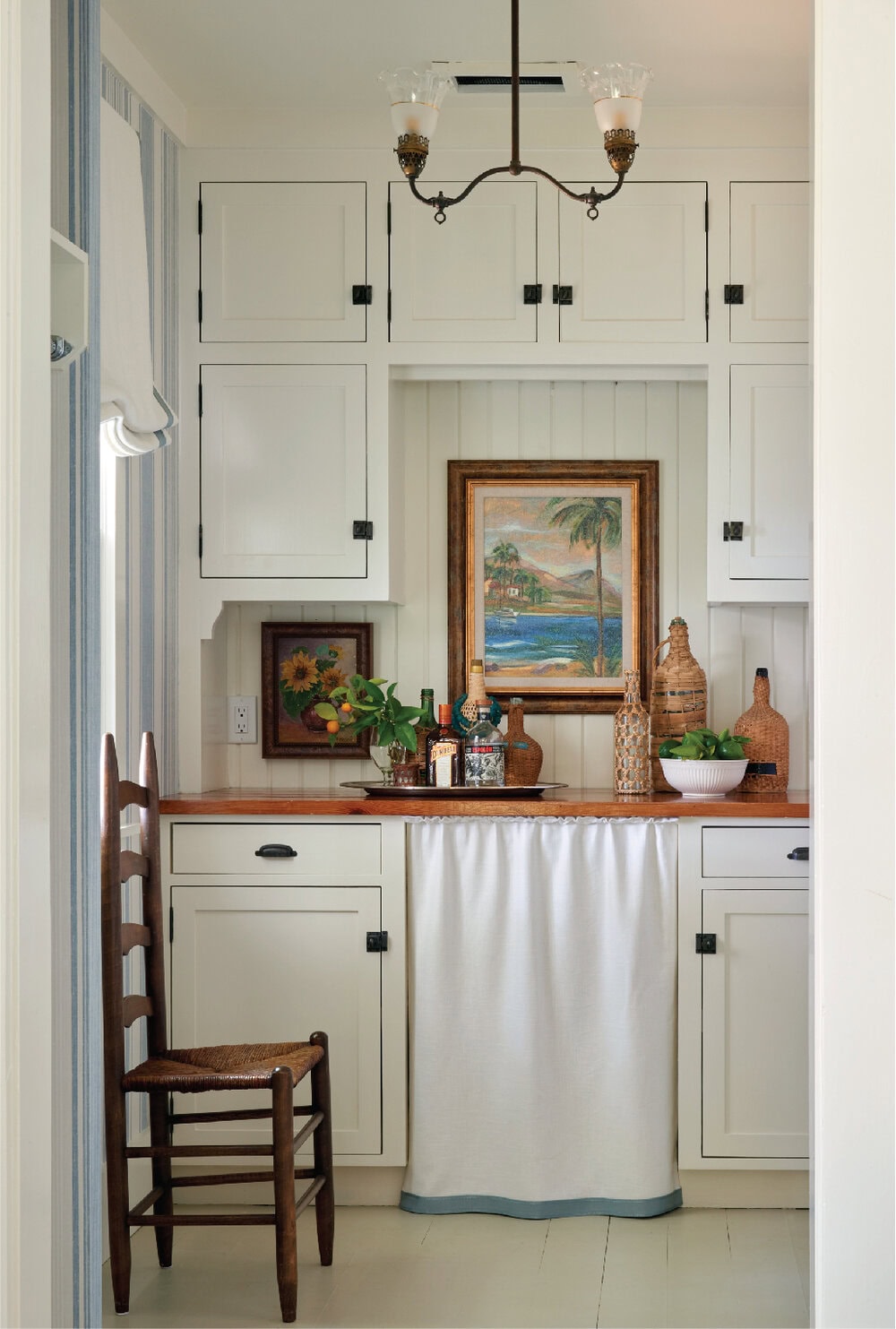 Rustic in white kitchen featured in interiors designed by Heather Chadduck
