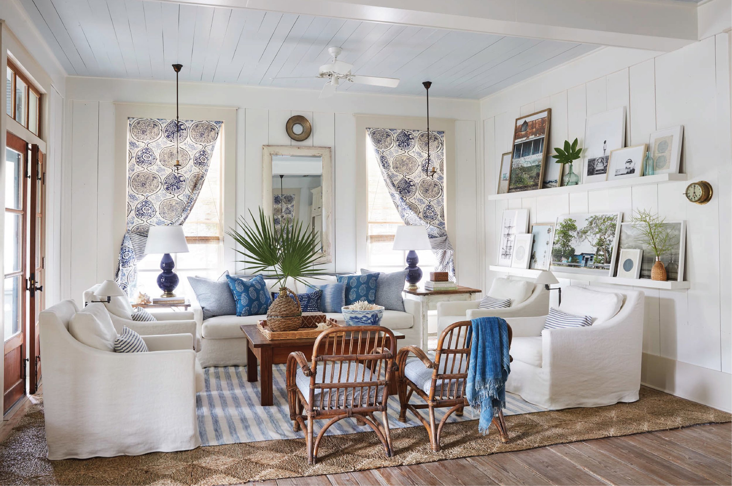 White and blue living room with coastal style featured in interiors designed by Heather Chadduck