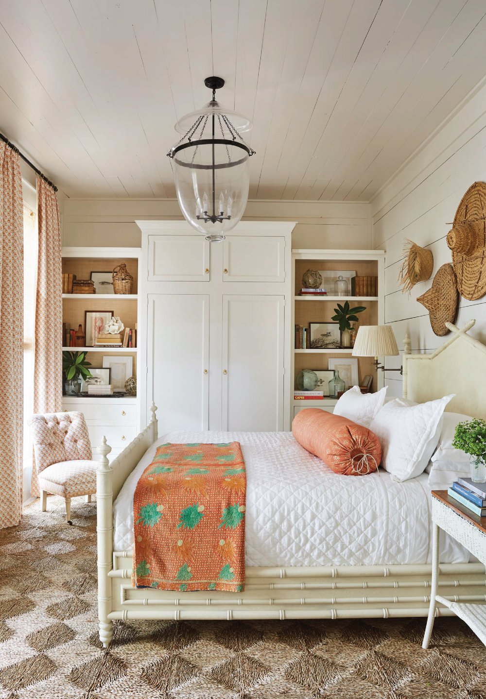 White and coral bedroom with tropical accents featured in interiors designed by Heather Chadduck