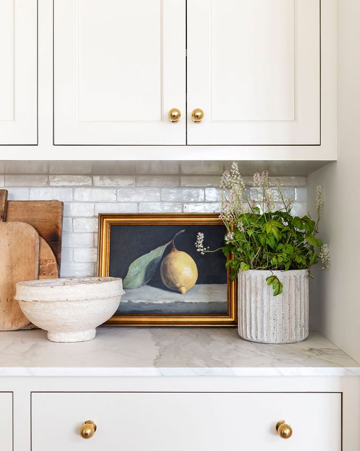 kitchen featuring a shelf with framed painting as example for old and outdated kitchen ideas