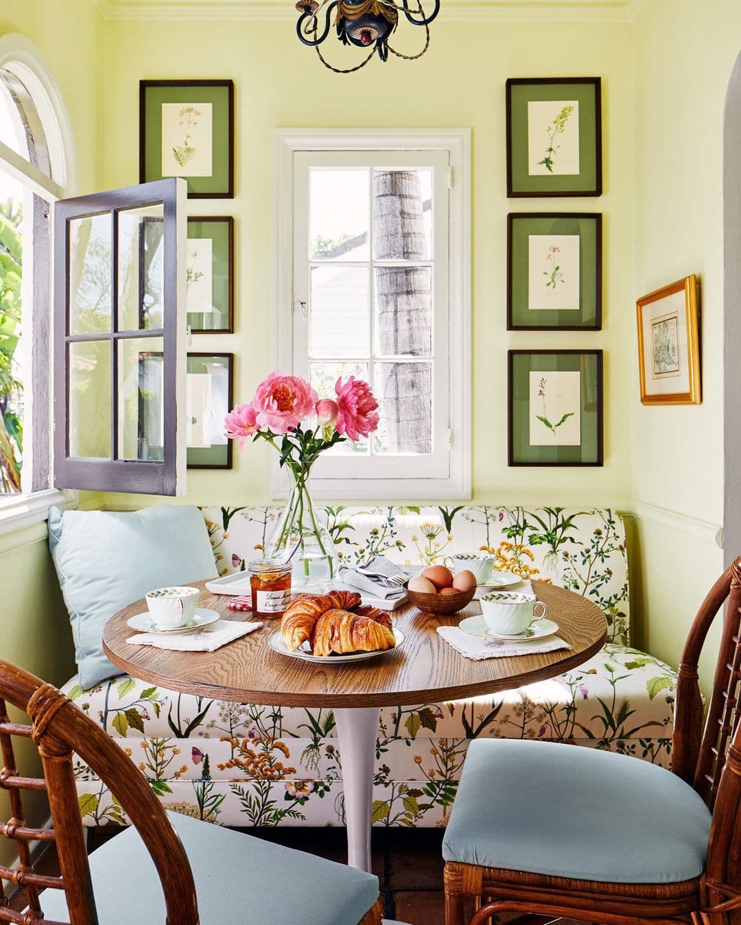 Breakfast nook featuring botanical prints in green featured in summer decor ideas