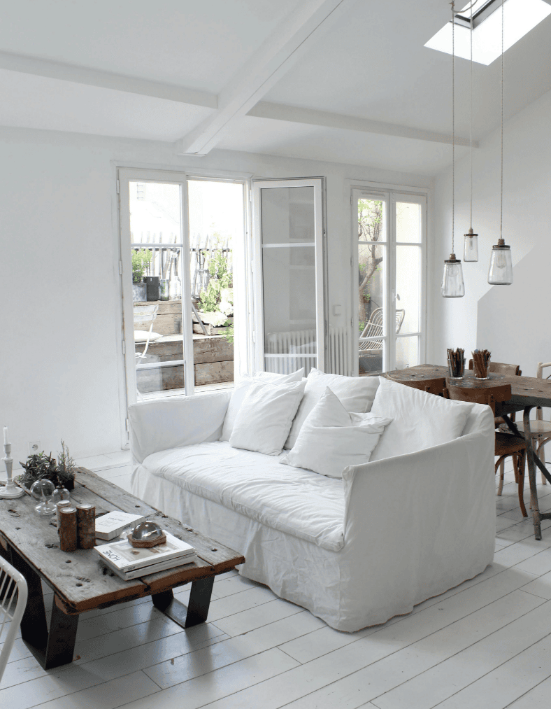 Neutral all white open concept living room featured in summer decor ideas