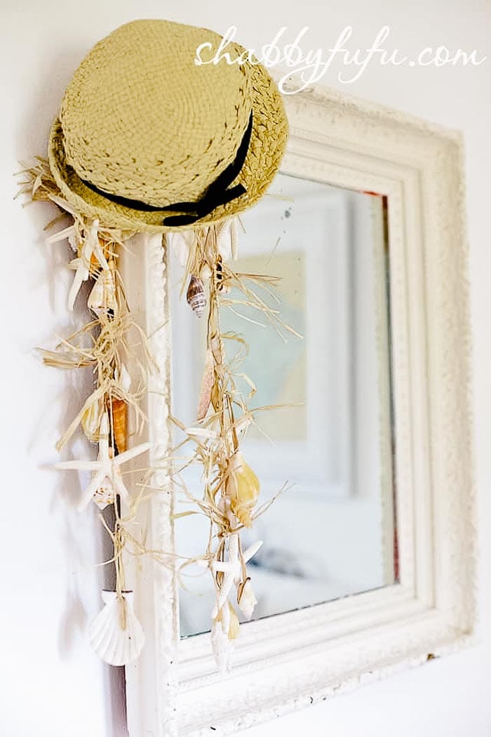 seashell garland and old beach wicker hat