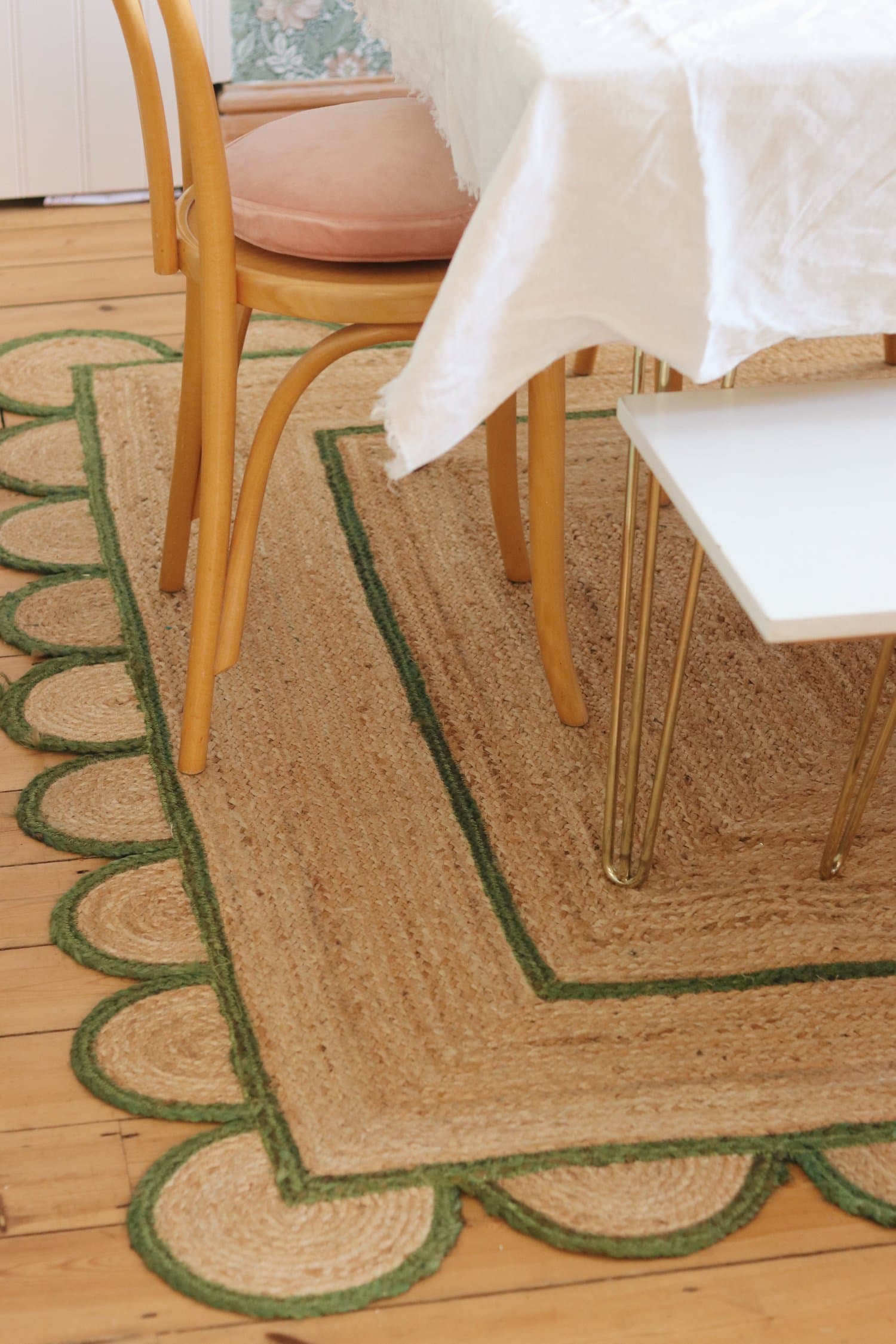 Scalloped rug edge in dining room featured in summer decor tips