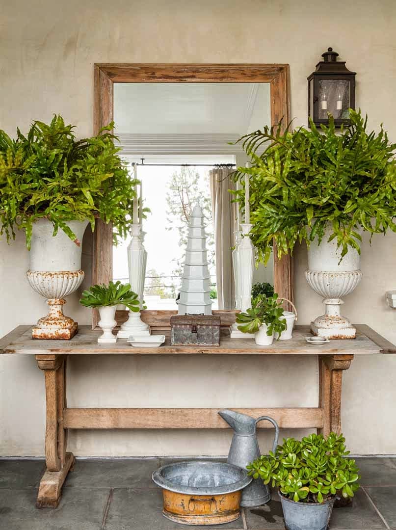 Summer decor tips featuring rustic table in front porch with outdoor mirror