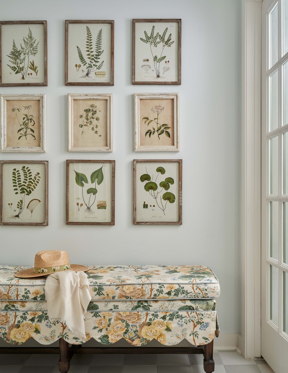 Entryway with botanical framed illustrations featured in summer decor tips