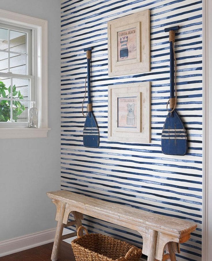 Idea to embrace a nautical theme decor featuring entryway with striped wallpaper