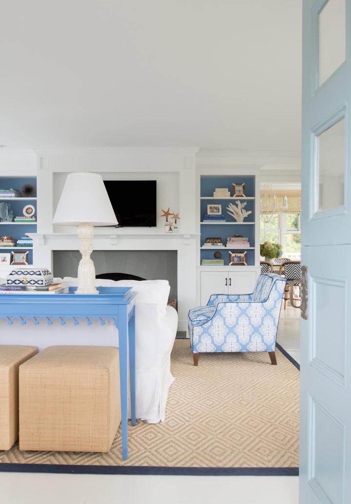 Room in traditional coastal, example of blue living room ideas with blue accents