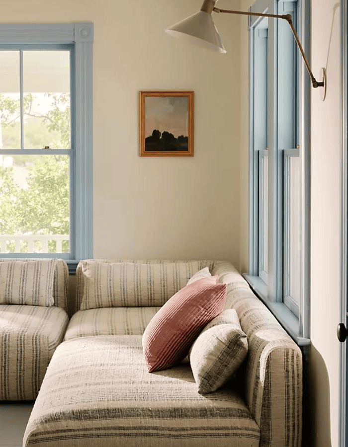 Room in traditional coastal, example of blue living room ideas with blue accents