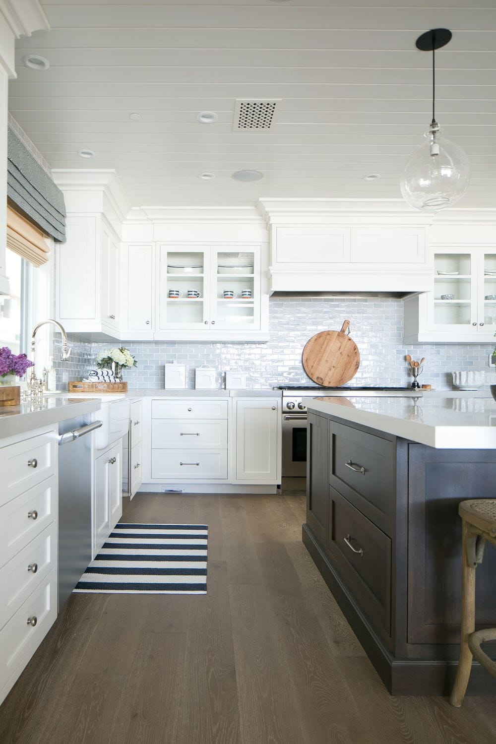 Neutral kitchen cabinet colors example featuring a modern traditional kitchen idea with crisp white cabinets.