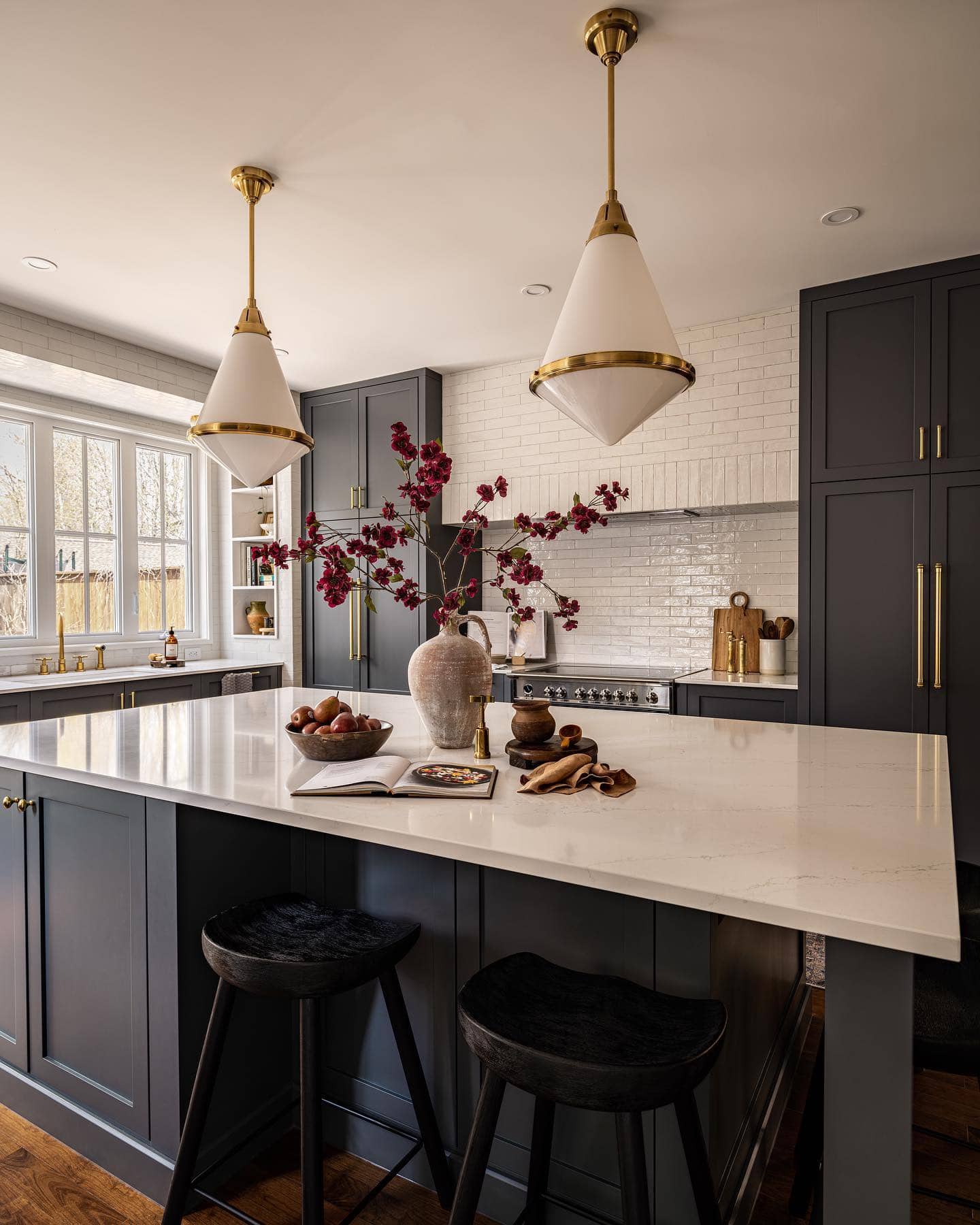 Neutral kitchen cabinet colors example featuring a modern traditional kitchen idea with dark blue gray cabinets.