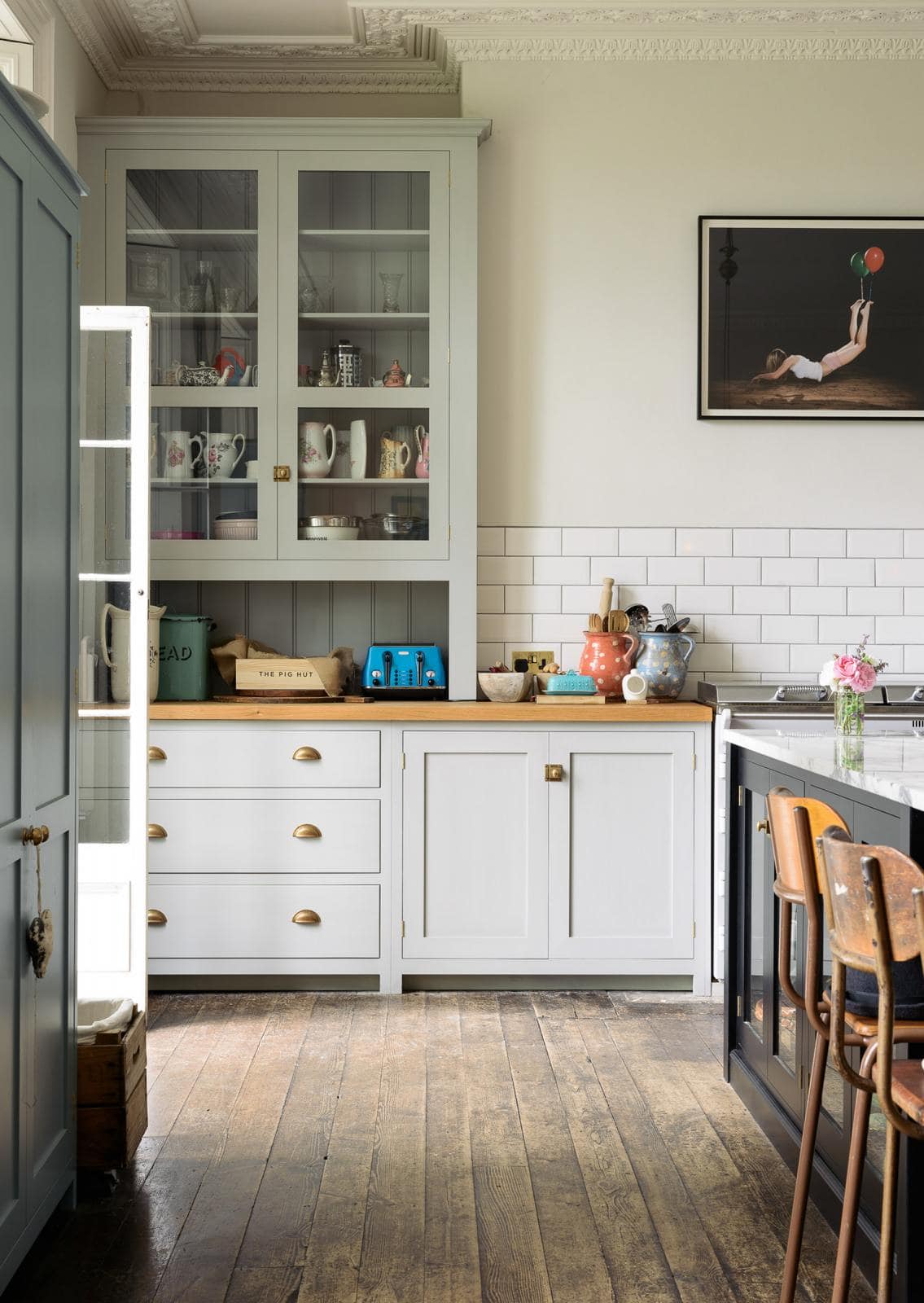 Neutral kitchen cabinet colors example featuring a modern traditional kitchen idea with light blue gray cabinets.