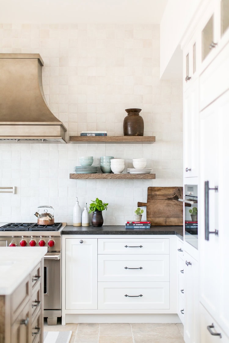 Neutral kitchen cabinet colors example featuring a modern traditional kitchen idea with crisp white cabinets.