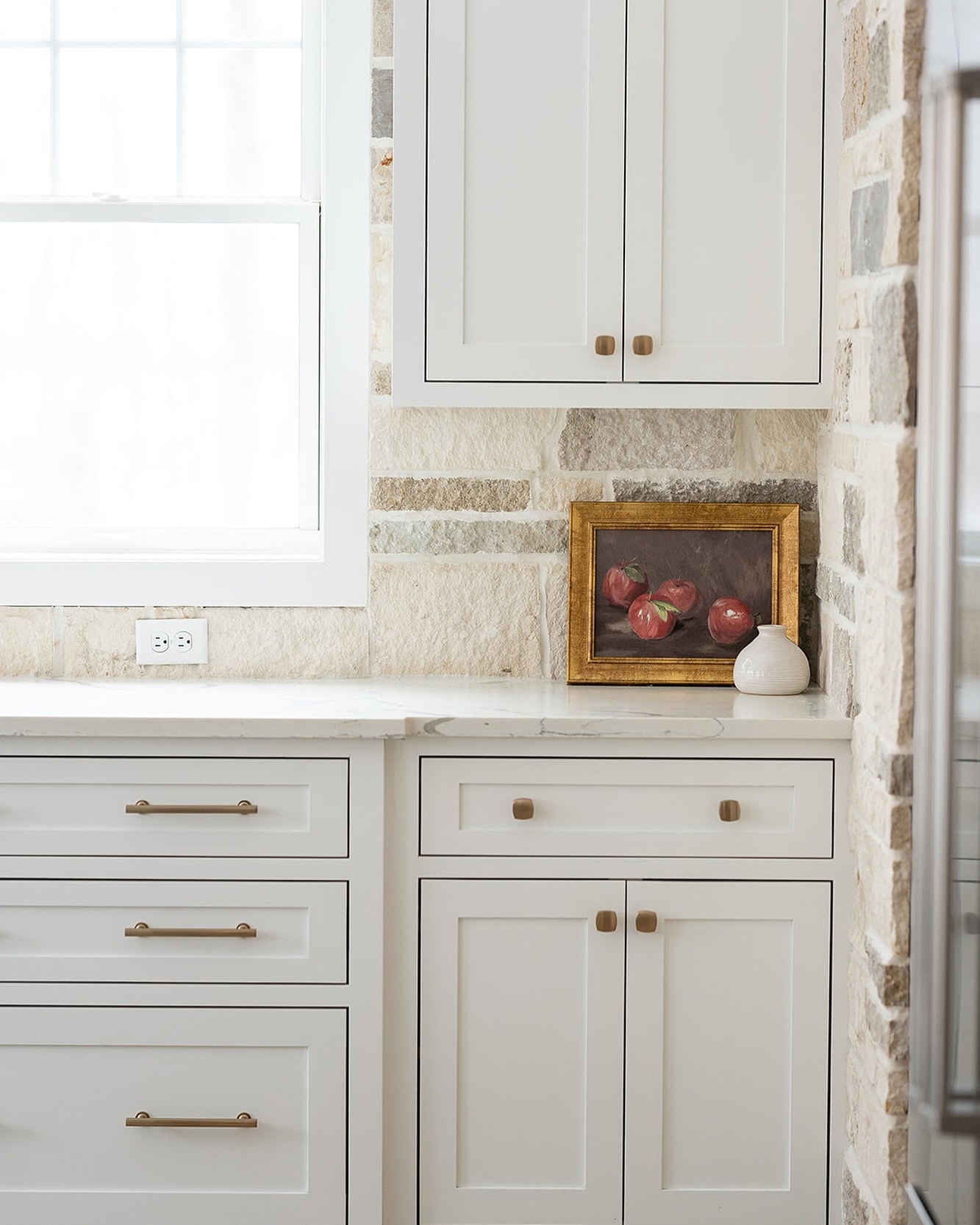 Neutral kitchen cabinet colors example featuring a modern traditional kitchen idea with crisp white cabinets.