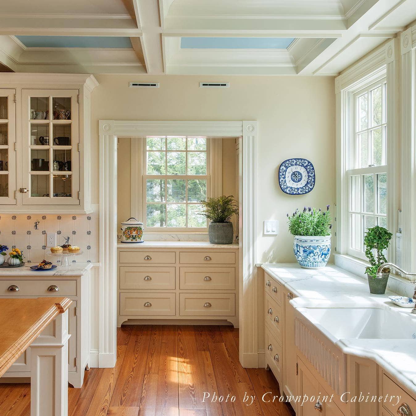 Neutral kitchen cabinet colors example featuring a modern traditional kitchen idea with warm white cabinets.